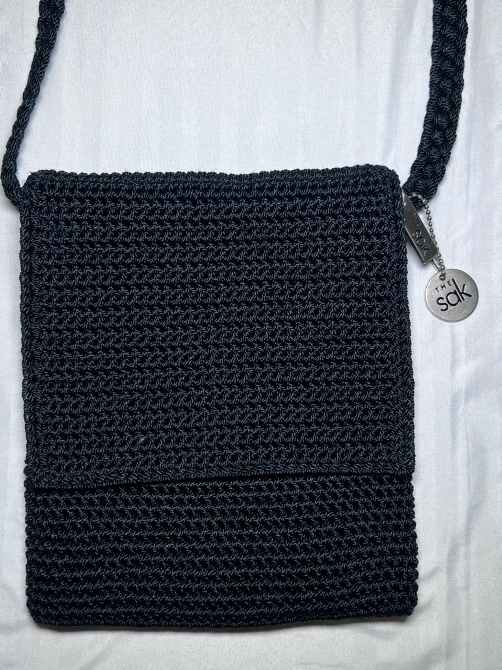 The Sak Black Crochet Shoulder Bag with Logo Charms